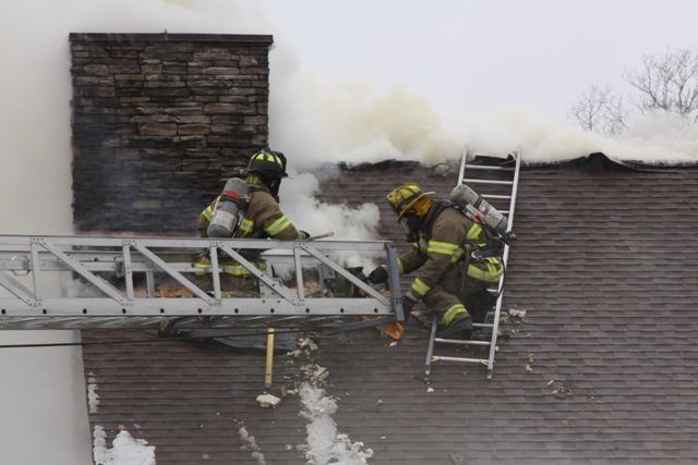 Firefighters putting out a fire at Camp Marymount Fire in 2011.